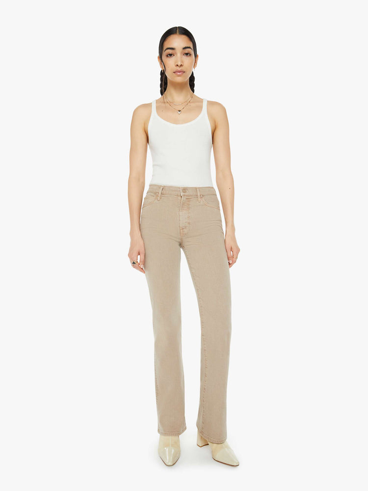 Front view of a woman in a light khaki high-rise straight leg with a 32-inch inseam and a clean hem.