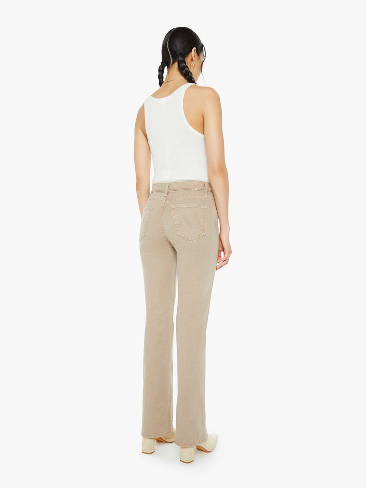 Back view of a woman in a light khaki high-rise straight leg with a 32-inch inseam and a clean hem.