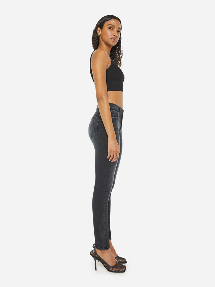 Side view of a woman back mid-rise skinny jean with 29 inch inseam.