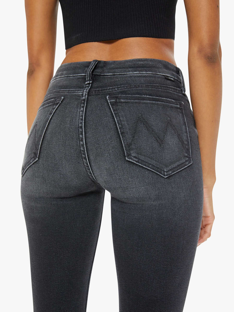 Close up view of a woman back mid-rise skinny jean with 29 inch inseam.