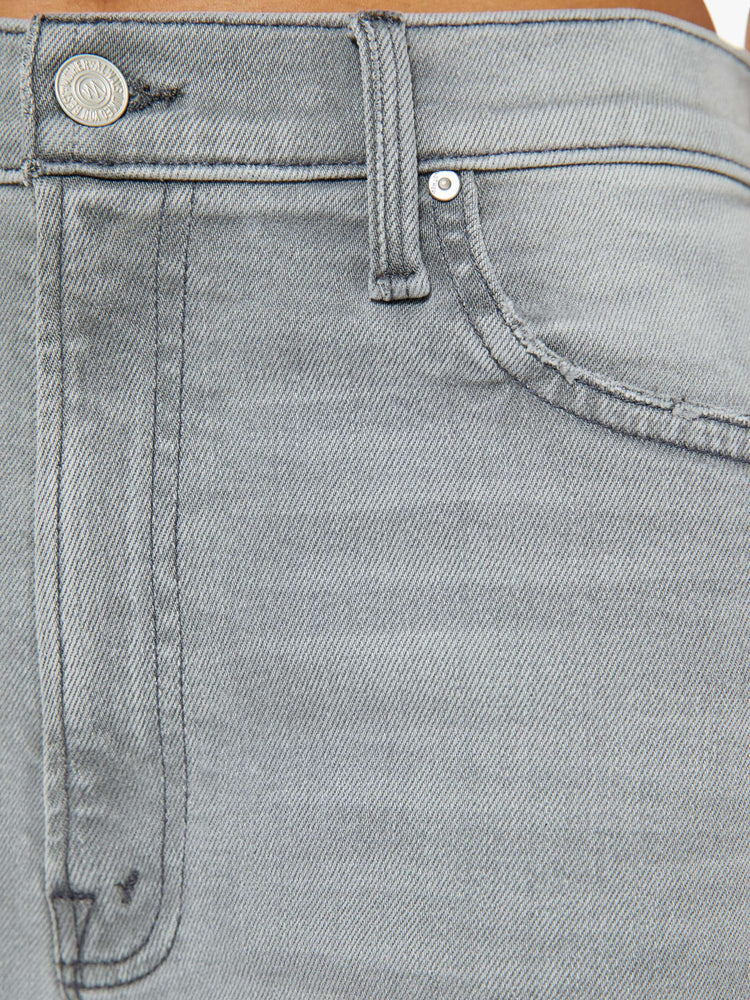 Swatch view of a woman in grey jean with a slouchy fit, a loose straight leg and a 28.25-inch inseam with a clean hem.