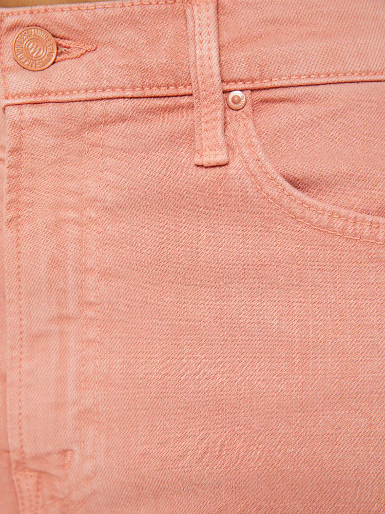 Swatchview of a woman in light coral pants designed to sit on the hips with a slouchy fit, a loose straight leg and a 32-inch inseam with a clean hem.