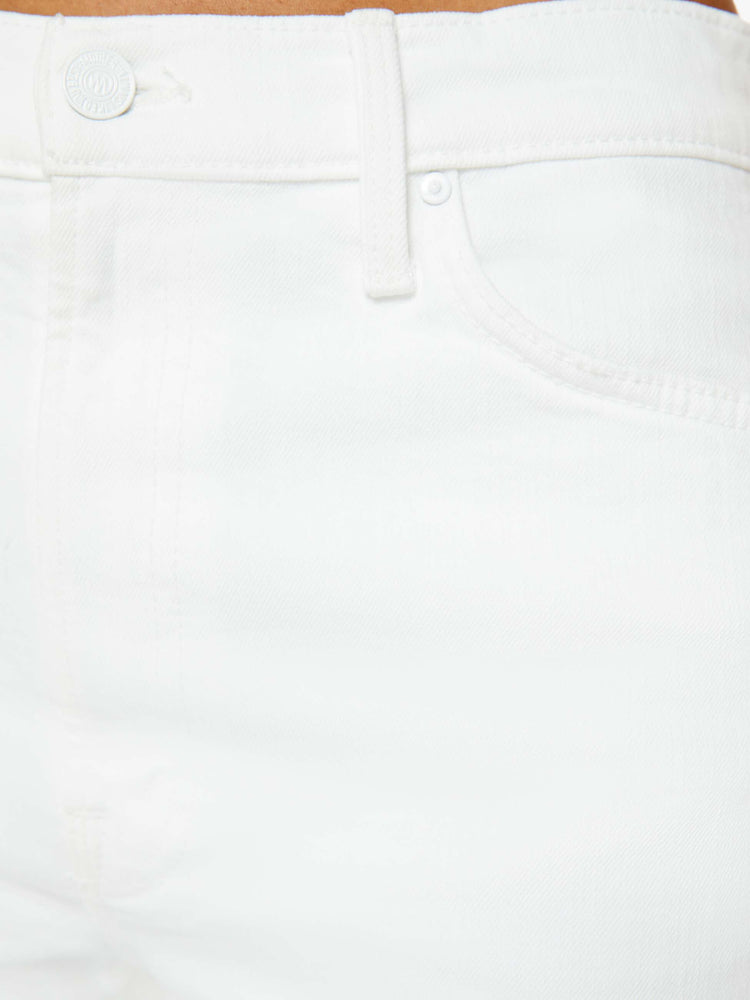 Swatch view of a woman in a white denim designed to sit on the hips with a slouchy fit, this loose straight leg has a 32-inch inseam with a clean hem. 