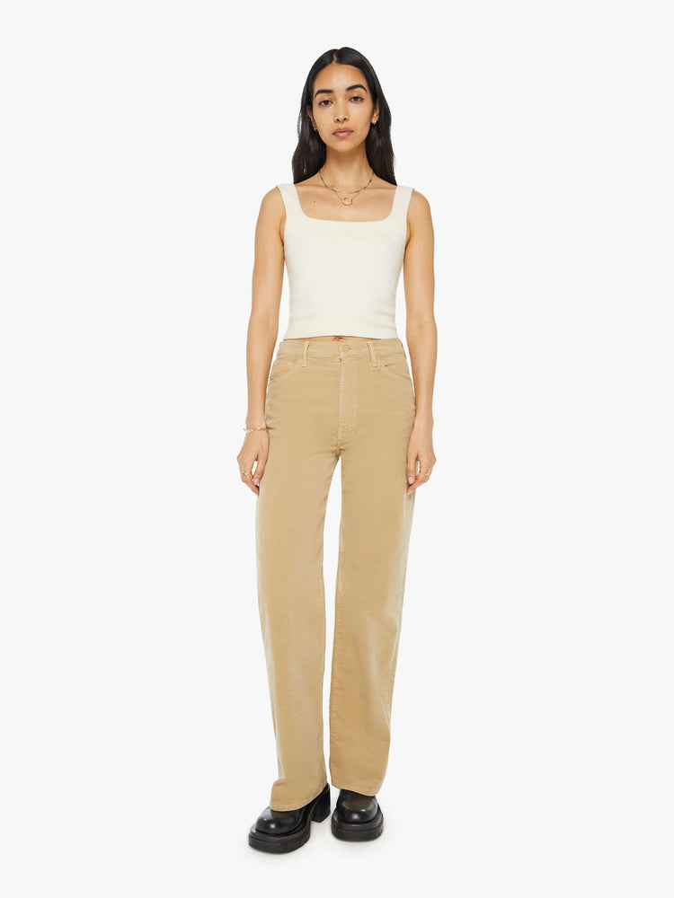 Front view of a woman in a light khaki corduroy loose straight leg jean with a 32-inch inseam.