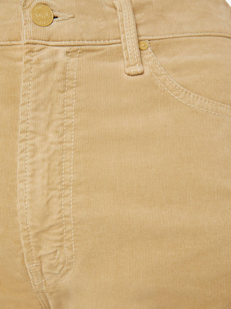 Detailed view of a woman in a light khaki corduroy loose straight leg jean with a 32-inch inseam.