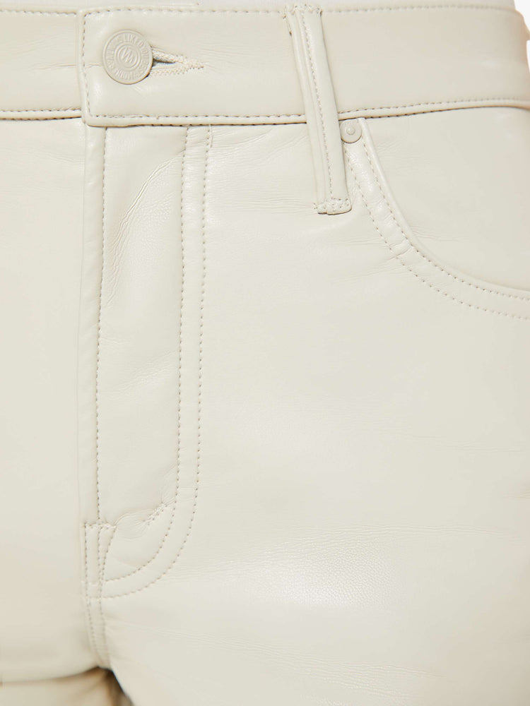 Swatch view of a woman in a high-waisted pants with a wide straight leg, zip fly and an ankle-length inseam with a clean hem in cream leather pants.