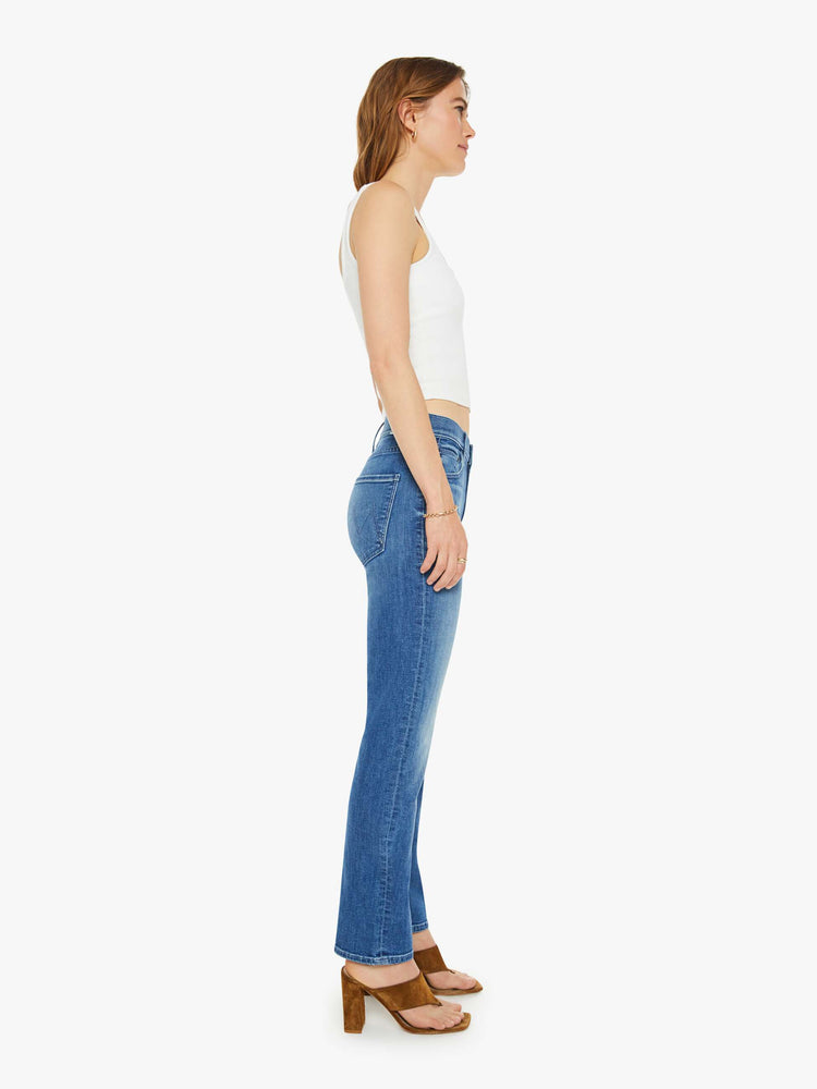 Side view of a mid-rise straight-leg jeans with an ankle-length inseam and a clean hem. 