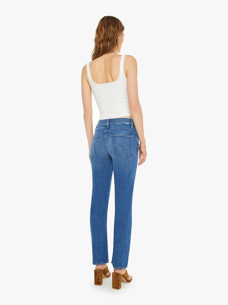 Back view of a mid-rise straight-leg jeans with an ankle-length inseam and a clean hem. 