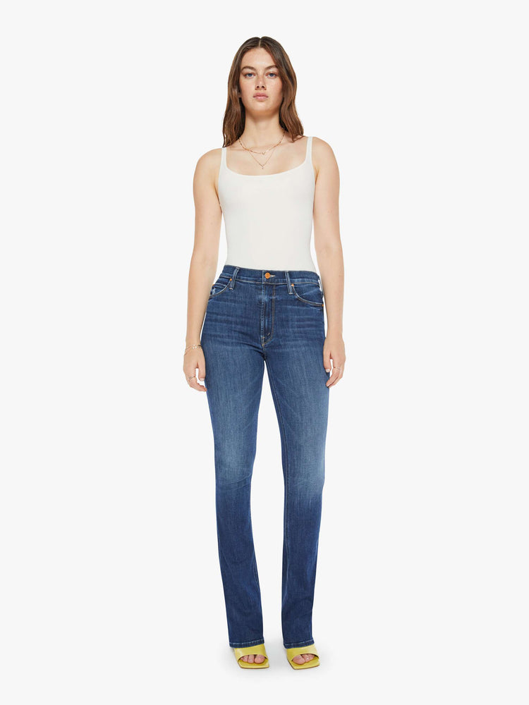 Front view of a dark blue wash denim skinny flare featuring a high rise.