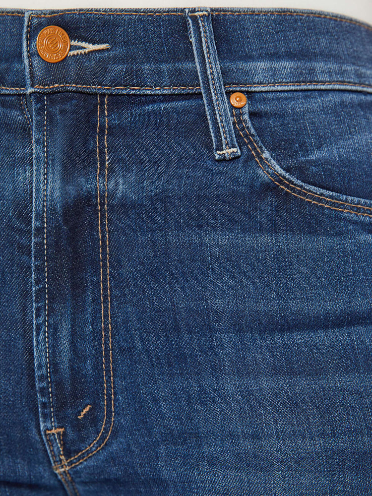 Swatch view of a dark blue wash denim skinny flare featuring a high rise.