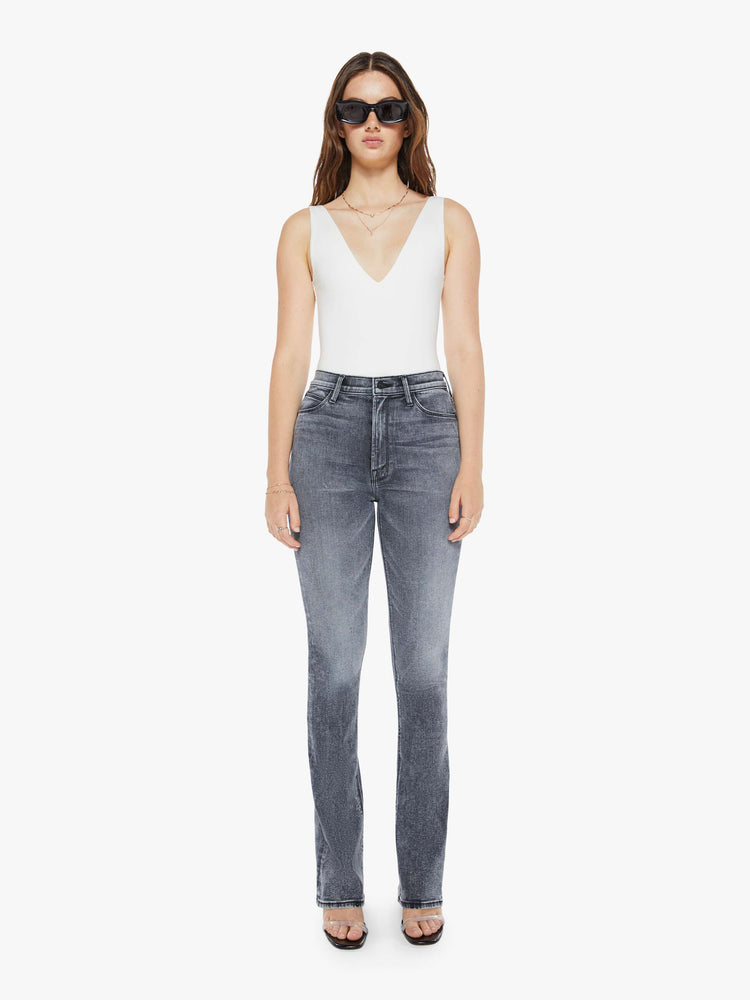 Front view view of a womens grey wash flare jean featuring a high rise, and a long clean hem.