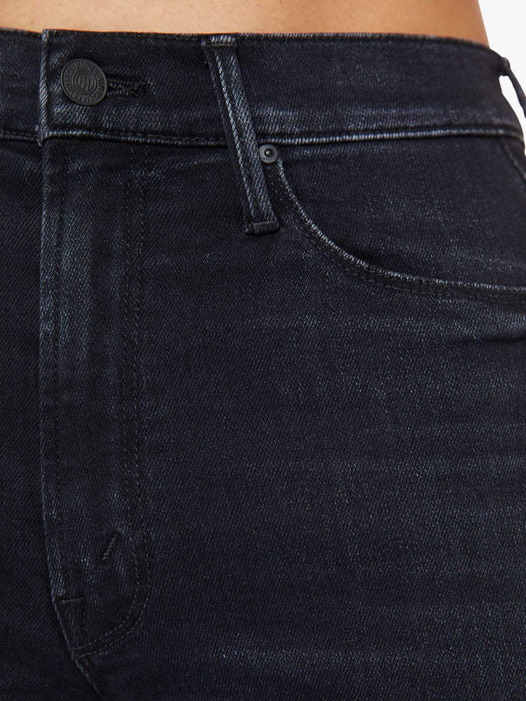 Swatch view of a womens high rise flare jean featuring a dark black wash and a clean hem.