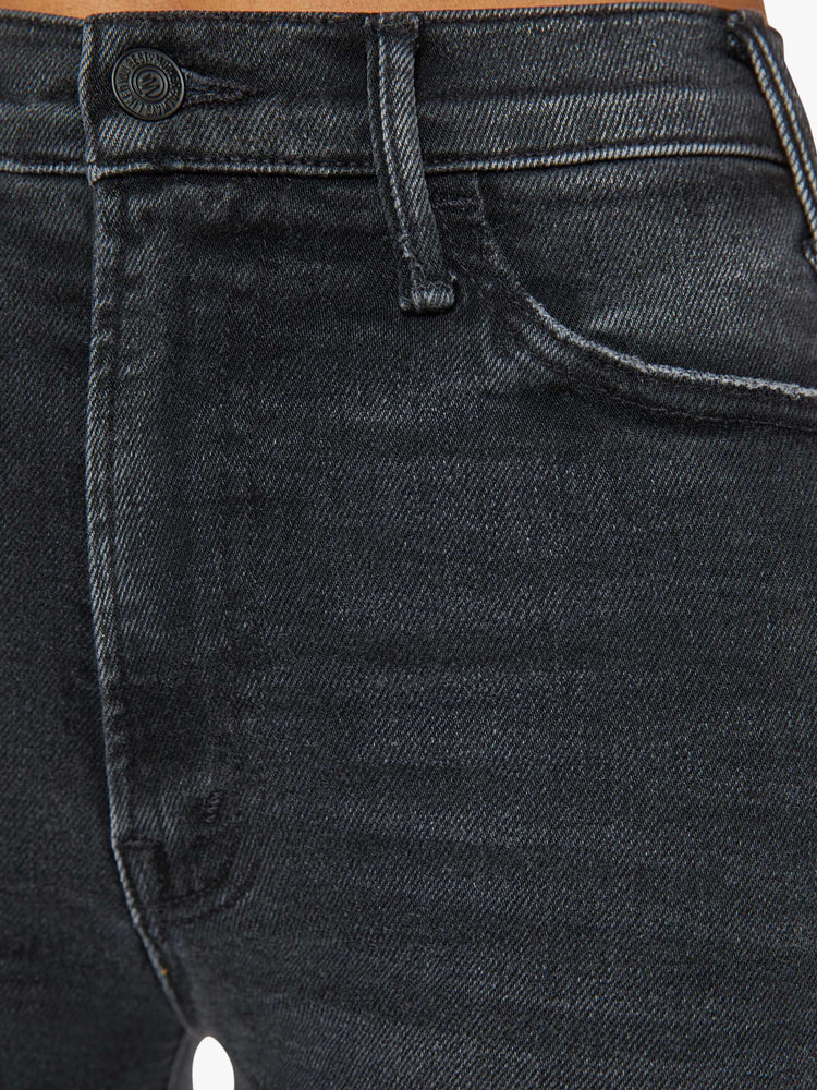 Swatch view of a woman in a black wash  wide leg jeans with a high rise, 30-inch inseam and a clean hem. 