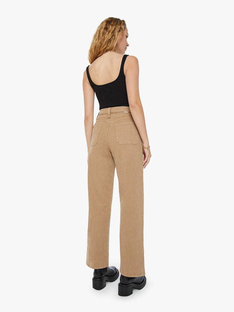 Back view of a woman super high-waisted pants with a wide straight leg, patch pockets and a long 31-inch inseam with a clean hem in a dark khaki.