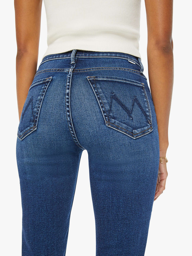 Swatch view of a woman in dark blue high-rise straight leg with a 32-inch inseam and a clean hem. 