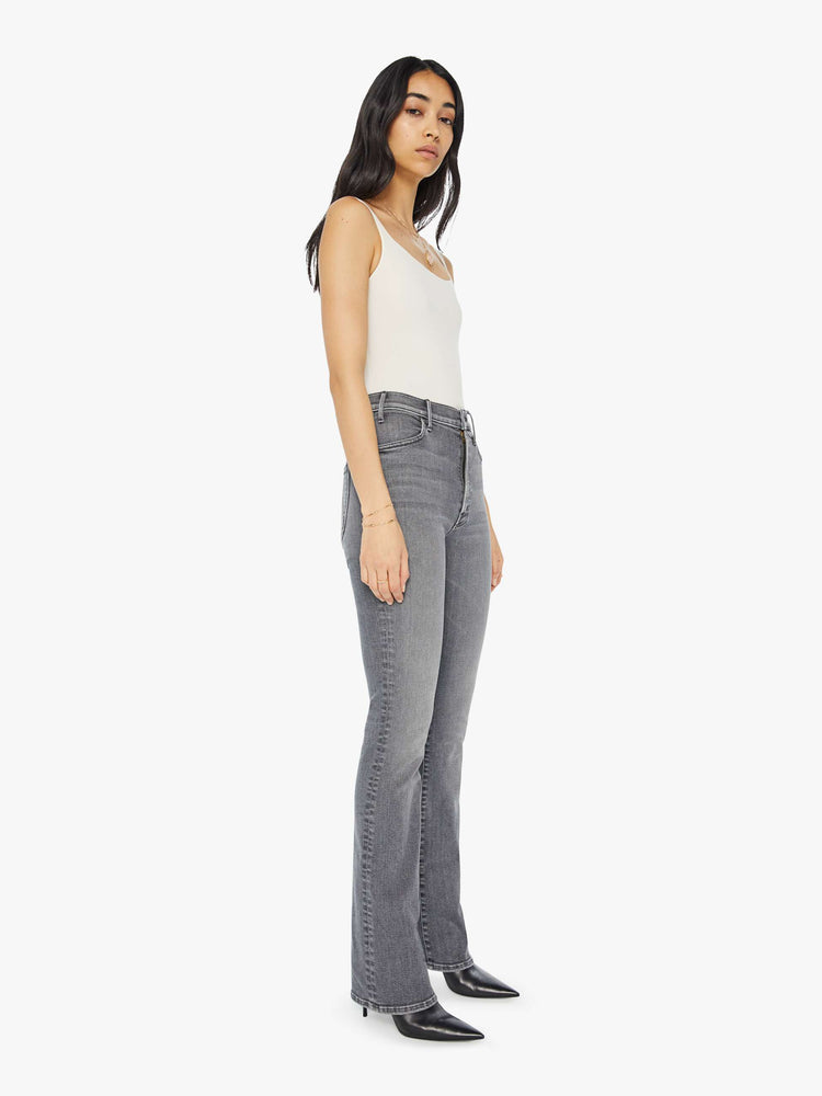 Side angle view of a light grey high-waisted flare jeans with a long 34-inch inseam and a clean hem.