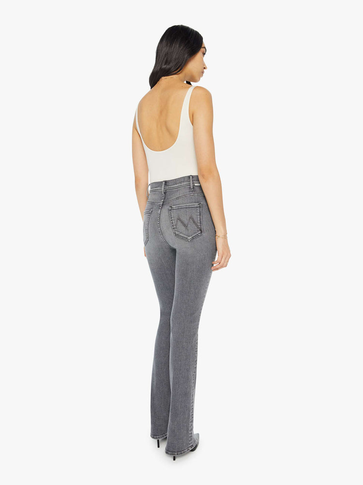 Back view of a light grey high-waisted flare jeans with a long 34-inch inseam and a clean hem.