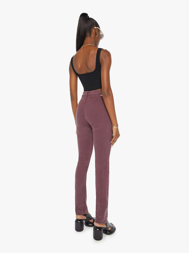 Back view of a woman in a maroon high-waisted skinny leg with a 31-inch inseam and a clean hem.