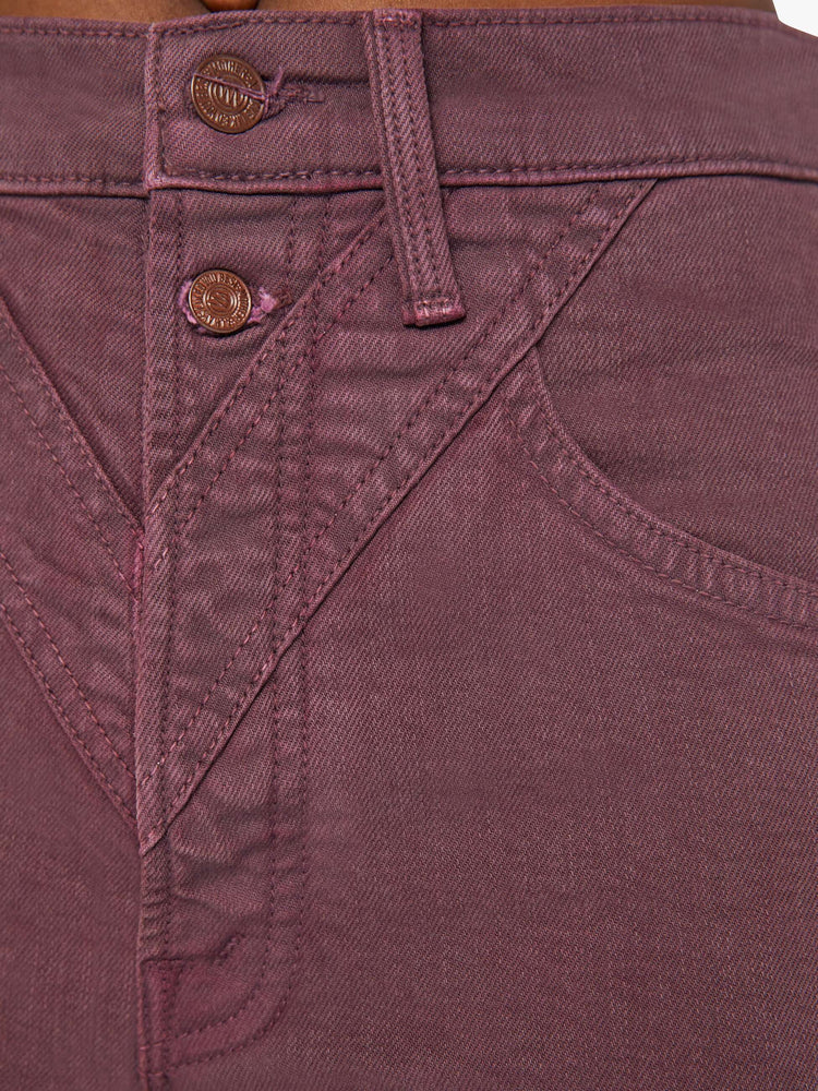 Swatch view of a woman in a maroon high-waisted skinny leg with a 31-inch inseam and a clean hem.