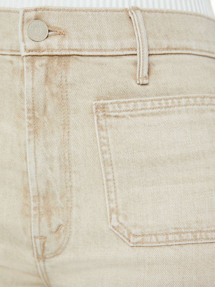 Swatch view of a woman in a light khaki wide leg pant with a high rise, long 32-inch inseam, patch pockets and a clean hem.