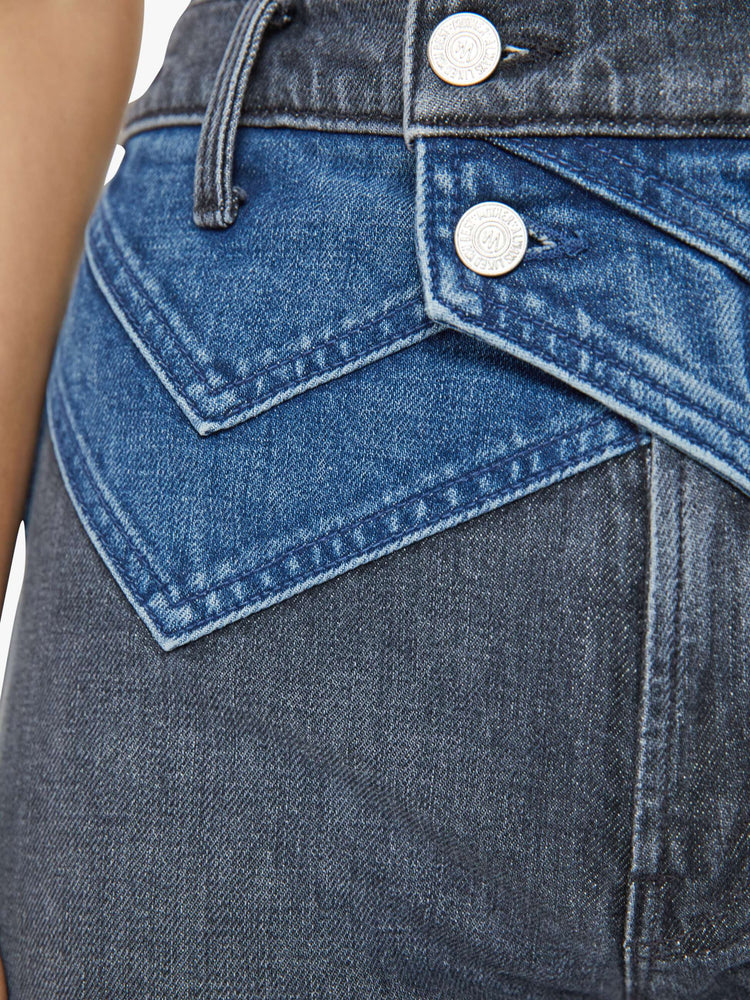 Swatch view of a woman in black and blue high-waisted jeans with a narrow straight leg, 2-button waistband, 30-inch inseam and a clean hem.