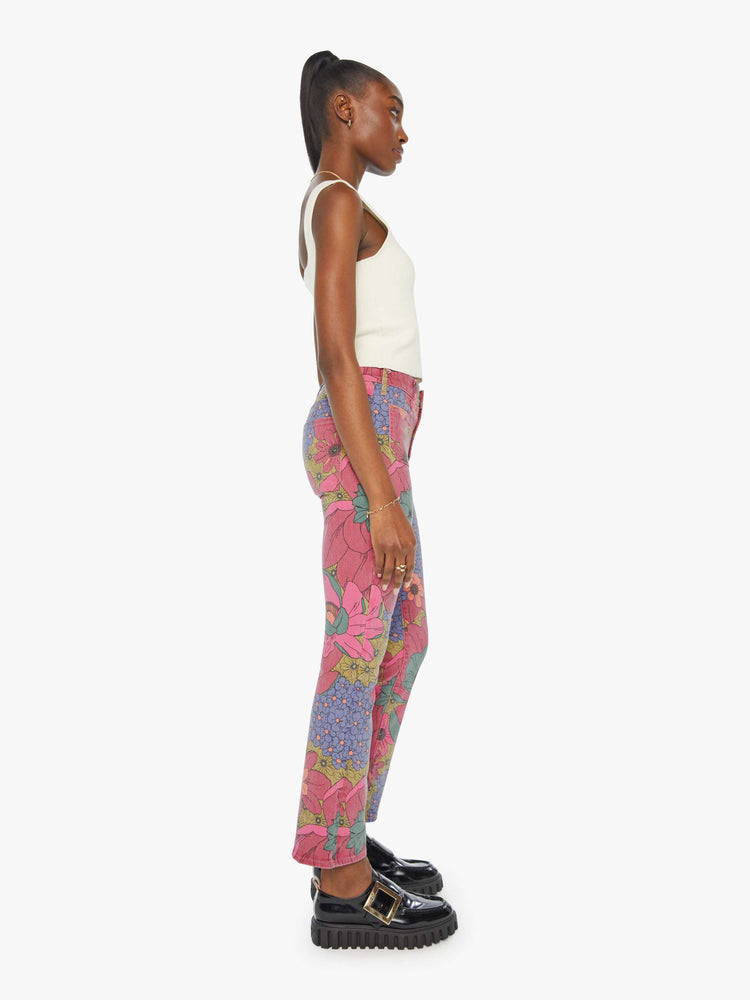 Side view of a faded floral print high-rise bootcut is designed with front patch pockets, a 28.25-inch inseam and a clean hem.