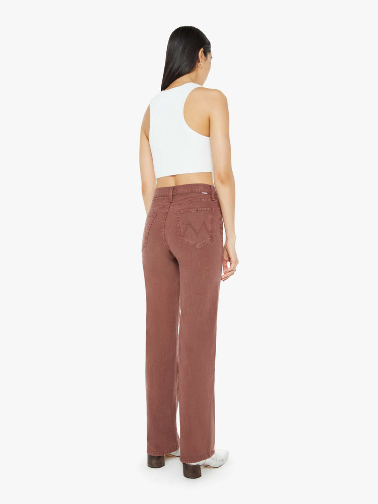 Back view of a woman in a brown high-waisted pants with a wide straight leg, zip fly and a long 32-inch inseam with a clean hem.