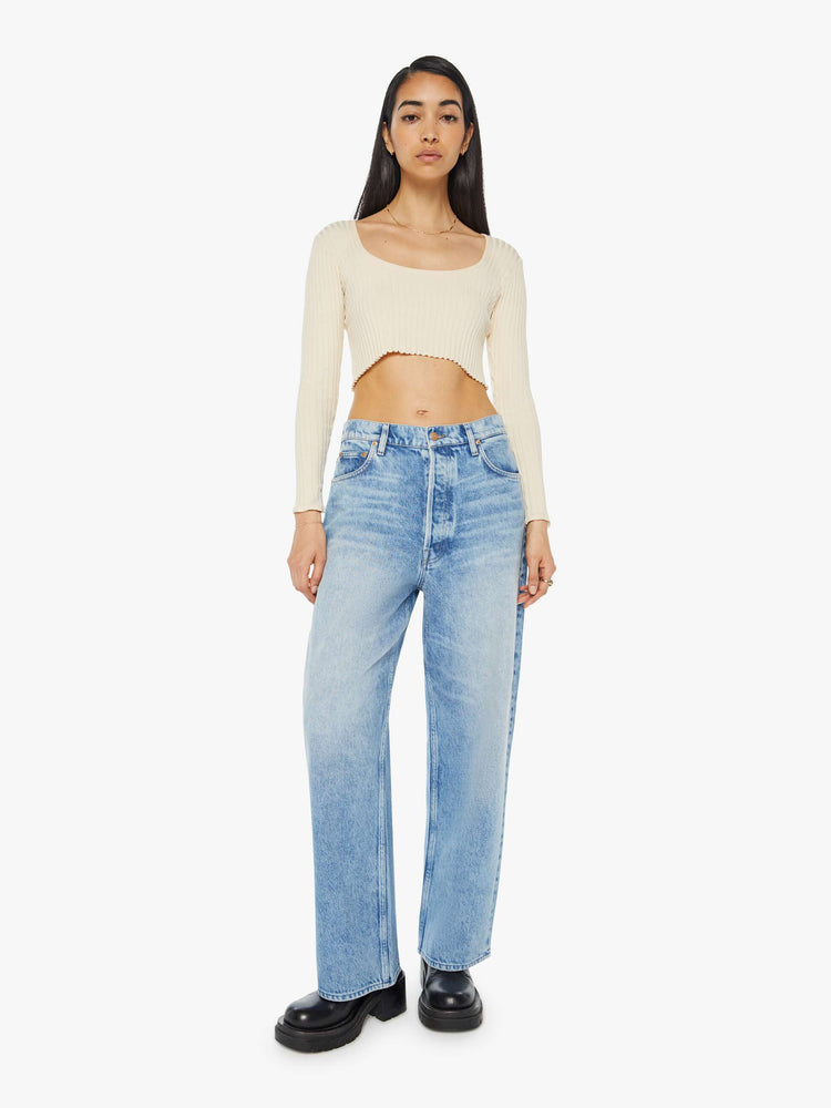 Front view of a light blue  super high-waisted jeans with a 29-inch inseam and a loose, slightly baggy fit.