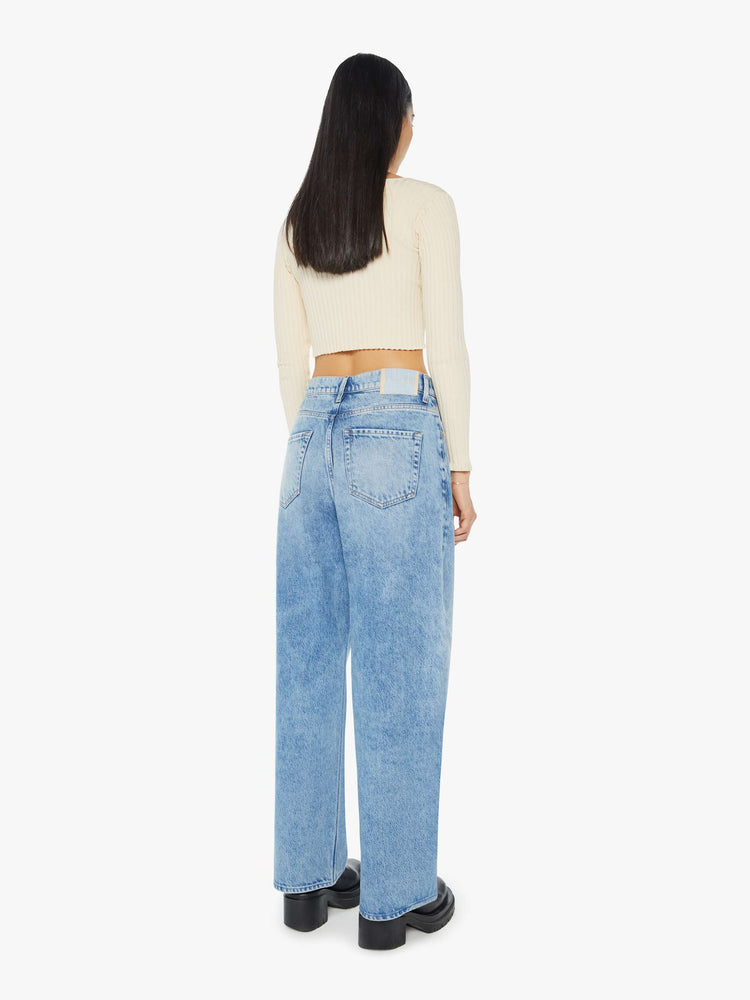 Back view of a light blue super high-waisted jeans with a 29-inch inseam and a loose, slightly baggy fit.