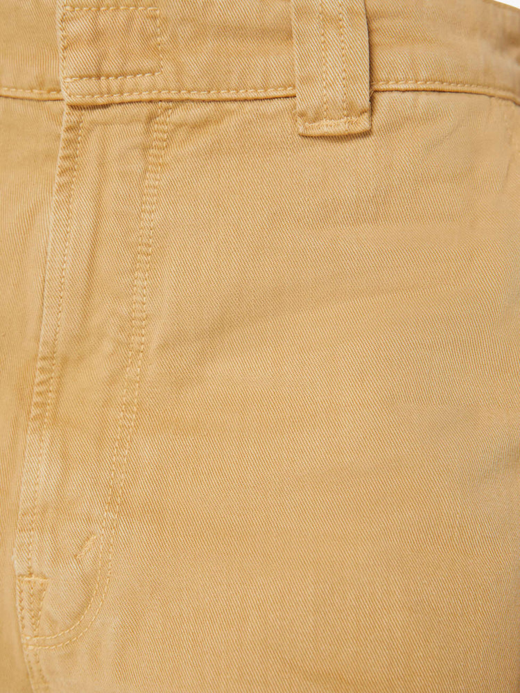 Swatch view of a woman in khaki slouchy straight-leg pants with a super high rise, slit pockets and a cropped inseam.