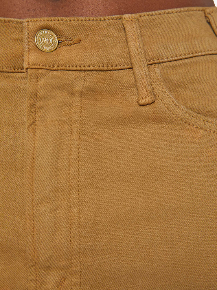 Swatch view of a woman in a khaki pant with a high-rise flare has a 28.25-inch inseam and a clean hem.