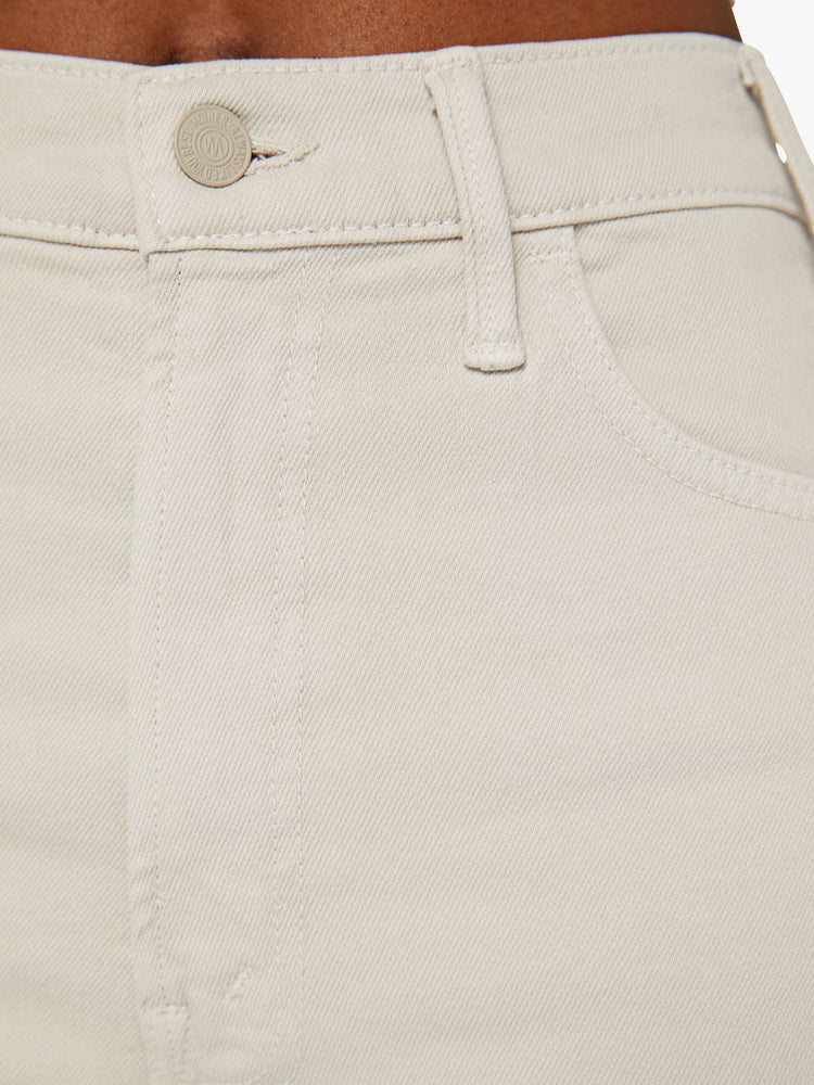 Swatch view of a woman in a high-rise  flare has a 28.25-inch inseam and a clean hem.