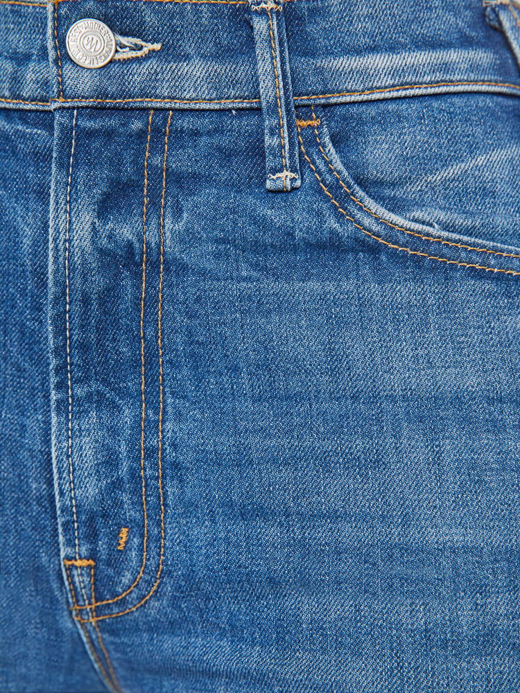 Swatch view of a woman wide leg jeans with a high rise, long 34-inch inseam and an oversized cuffed hem that's frayed in medium blue wash. 