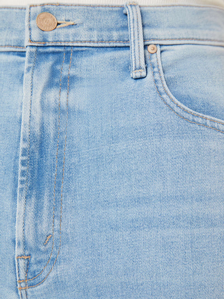 Swatch view of a woman Super high-rise jeans with a loose wide leg, zip fly and a 28.25-inch inseam with a clean hem in a light blue wash.