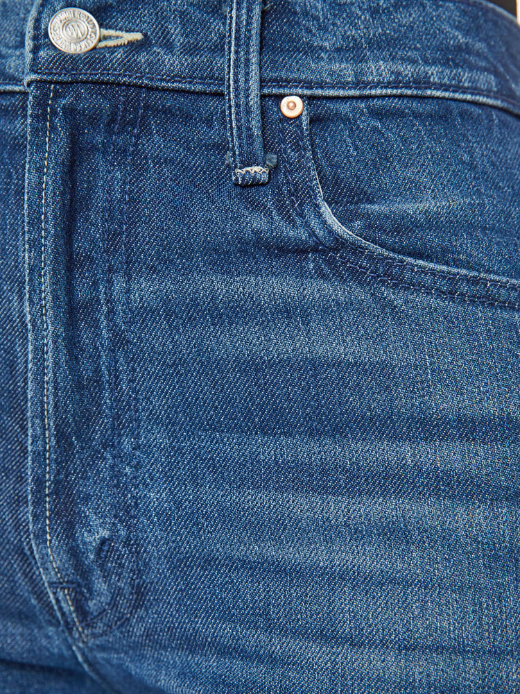 Swatch view of a woman med blue high-rise jeans with a wide straight leg, zip fly and a long 34-inch inseam with a clean hem.