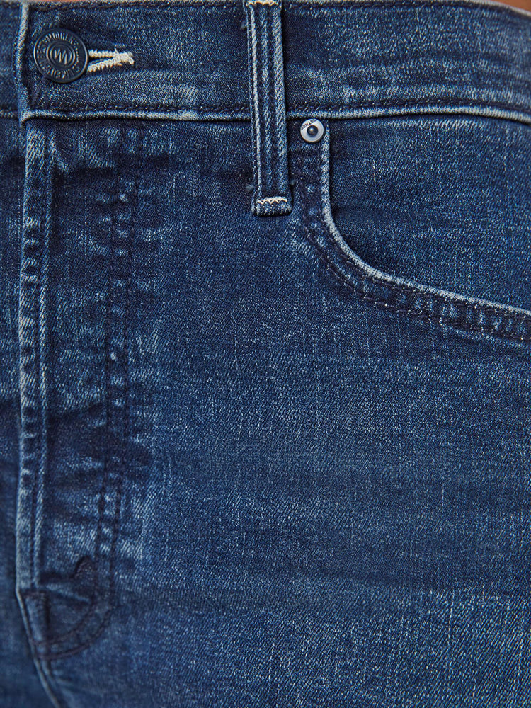 Swatch view of a dark blue high-waisted wide leg has a button fly, 32-inch inseam and clean hem.