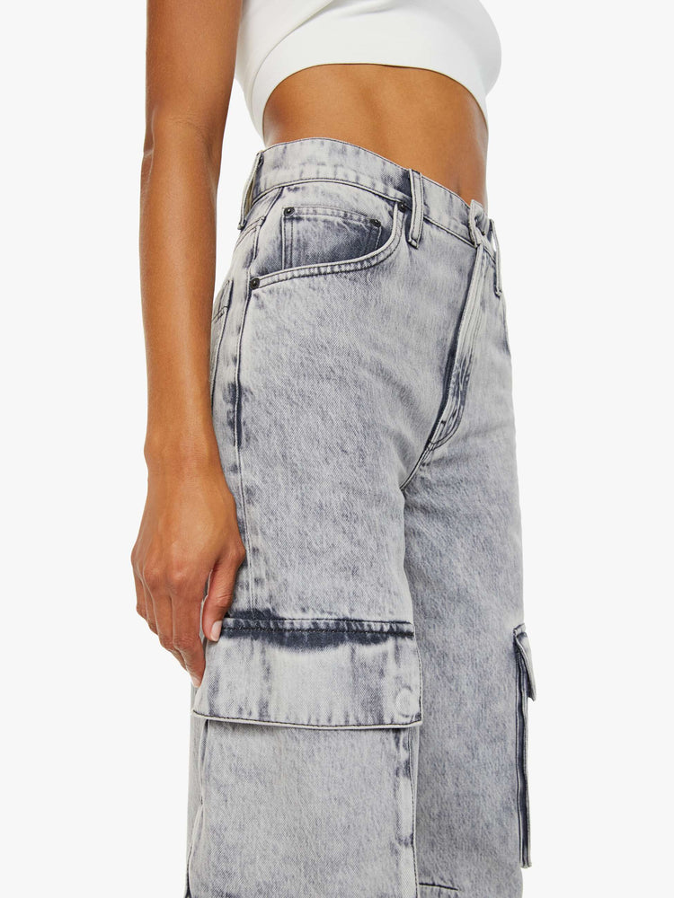 Swatch view of a woman in acid-washed grey wide-leg pants feature a super high rise, long 31-inch inseam, cargo-inspired patch pockets and a loose, slightly baggy fit.