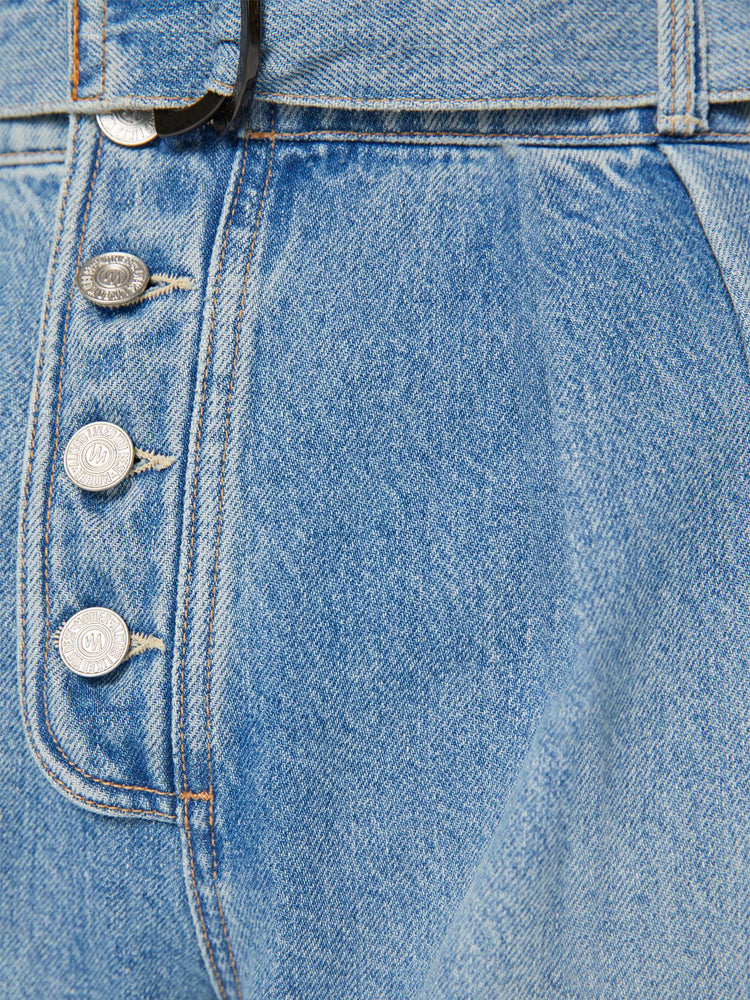 Swatch view of a light blue super high-waisted wide-leg jean features a belted waistband with pleats and angled details, an exposed button fly and a long 31-inch inseam with a clean hem.