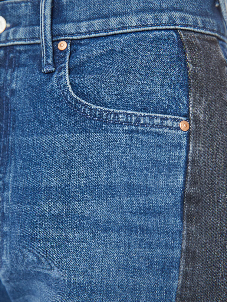 Swatch view of a woman in a black and blue super high-waisted jean with a wide, curved leg, a 26.25-inch inseam and a clean hem.