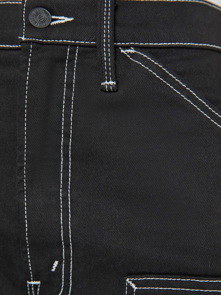 Swatch view of a woman super high-waisted pants with a wide leg, oversized patches at the knees, a long 32-inch inseam and a clean hem in black with white stitching.