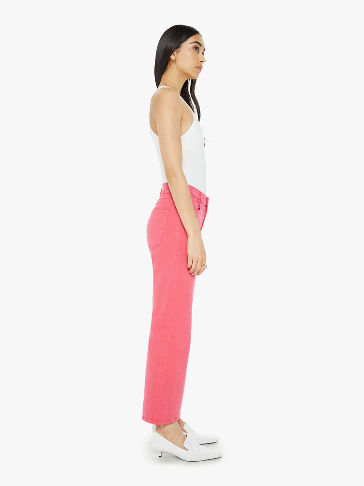 Side view of a bright pink mid-rise pants with a loose fit, wide leg and 28.25-inch inseam with a clean hem.