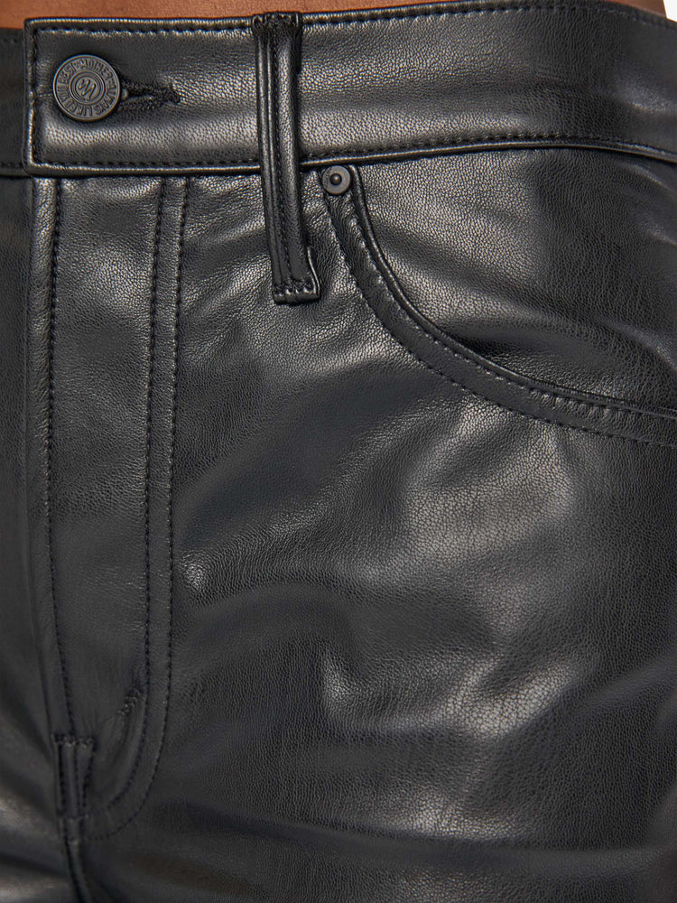 Swatch view of a woman black faux leather wide leg pants with a high rise, long 32-inch inseam and a clean hem.