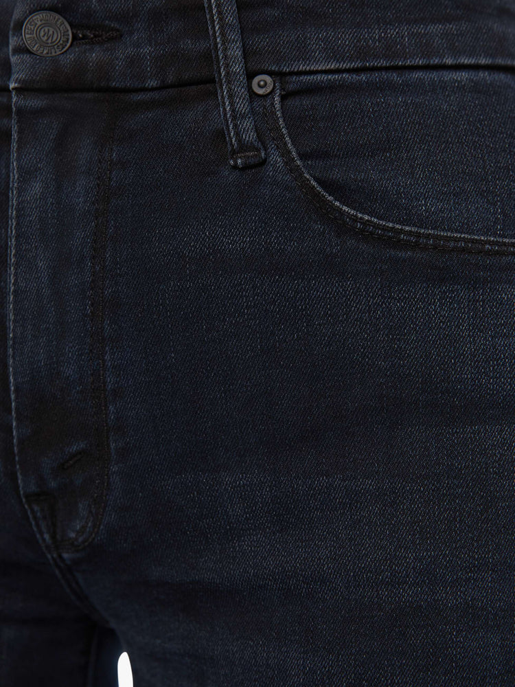 Swatch view of a woman in a dark denim with a high-waisted wide leg has a 31-inch inseam and a frayed hem.