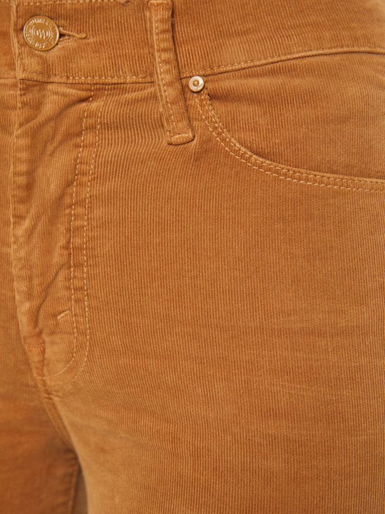 Swatch view of a woman in a mid rise with a 31-inch inseam and a clean hem in a golden orange corduroy.