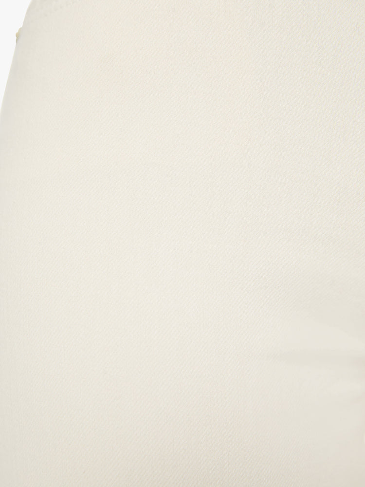 Swatch view of a woman midrise flare with a 31-inch inseam and a clean hem in an off white color.