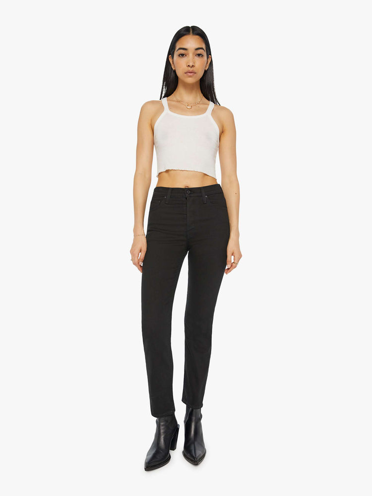 Front view of a women's black straight leg jean with a high rise and ankle length inseam.