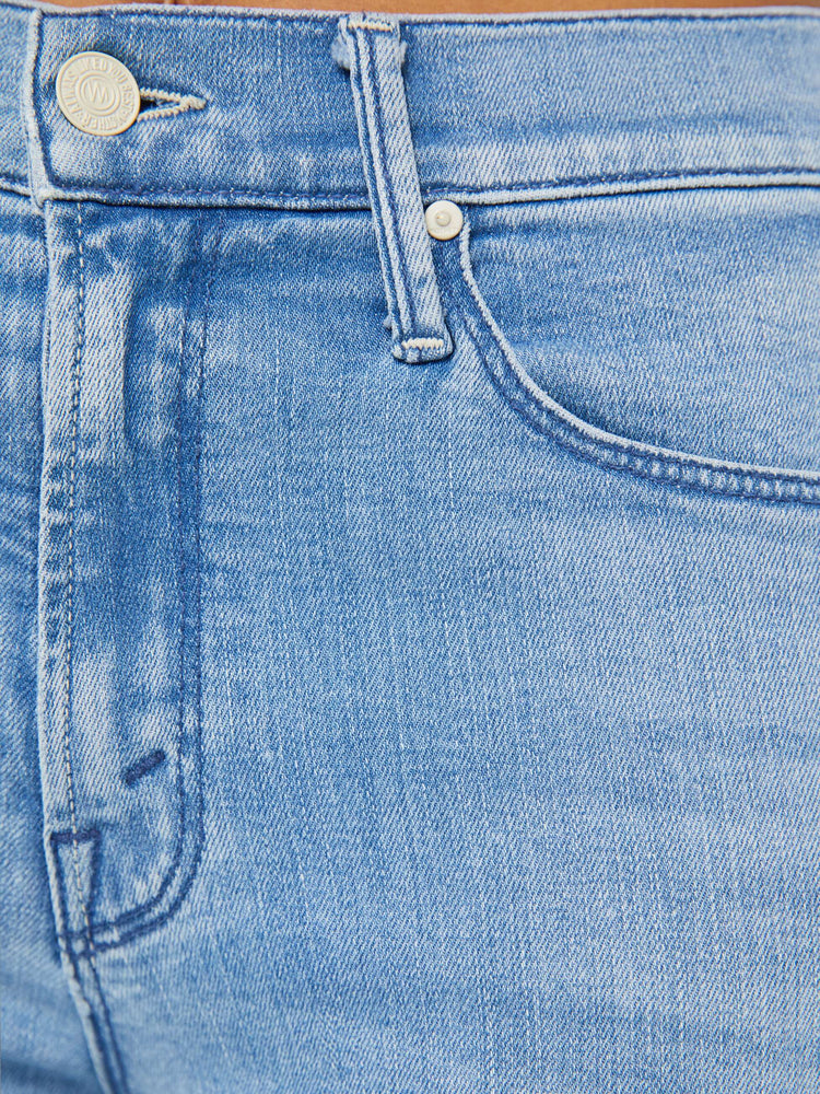 Close up swatch view of a light blue wash denim jean.