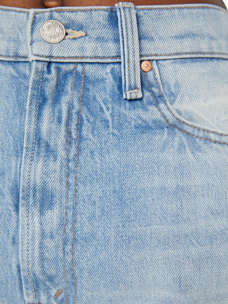 Swatch view of a woman high-waisted  straight-leg jeans with a 30-inch inseam and a clean hem in a light blue denim.