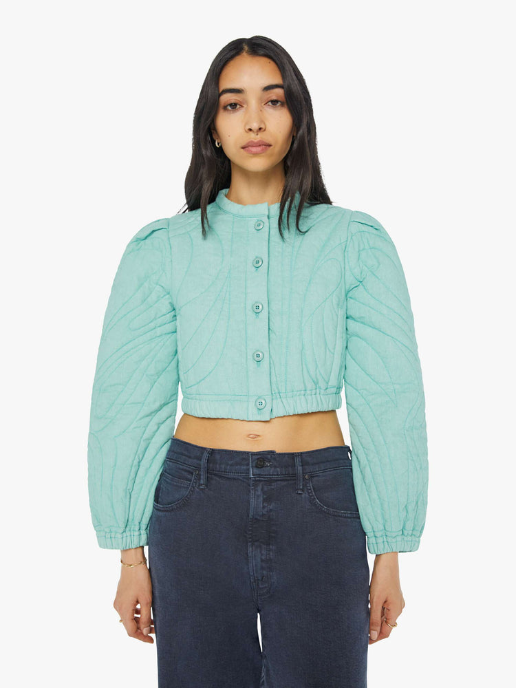 Front view of a woman real cropped crewneck jacket with voluminous balloon sleeves, elastic hems, slit pockets and buttons down the front.