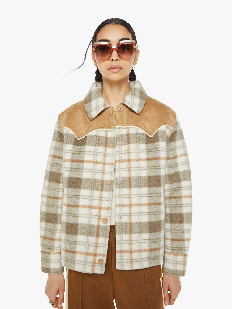 Front view of a tan plaid collared jacket with a Western-inspired yoke and snaps down the front. 